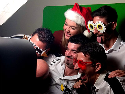 Six very excited guests posing at Smileme Photobooth at a wedding party in Corfu
