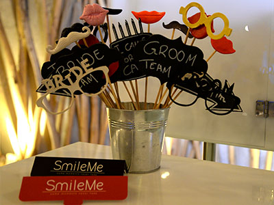 The wide variety of custom props and toys of Smileme Photobooth at a wedding in Corfu